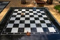A small chess table in the park. Empty board game table Royalty Free Stock Photo