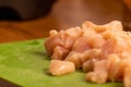 chicken pieces chopped up in a pile on a cuttingboard Royalty Free Stock Photo