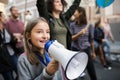 Small child with amplifier on global strike for climate change. Royalty Free Stock Photo