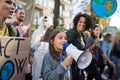 Small child with amplifier on global strike for climate change. Royalty Free Stock Photo