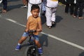 small child on a bicycle in the morning