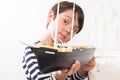 A small child builds a model ship