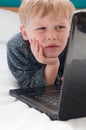 Small child captivated by the internet Royalty Free Stock Photo