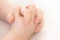 Child folding hands for prayer Royalty Free Stock Photo