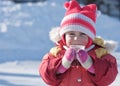 A Small Child Is Drinking A Hot Drink In Winter