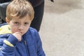 Small child eating popcorn in a park Royalty Free Stock Photo