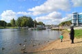 Mother and child feeding ducks