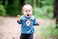 Small child in forest, shouting expression Royalty Free Stock Photo