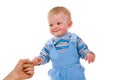 A small child is held by the hand of the parents Royalty Free Stock Photo