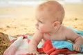 A small child is lying on the sea shore Royalty Free Stock Photo