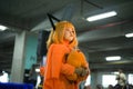 a small child is playing the character pochita denji from the anime chainsaw man, the little female cosplayer