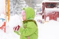 Small child playing with first snow Royalty Free Stock Photo