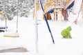 Small child playing with first snow Royalty Free Stock Photo