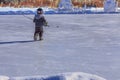 Young Hockey Player Chasing a Puck