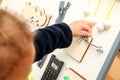 The small child plays with the activity board