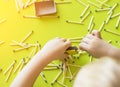 A small child plays with matches, matches matches into boxes, close-ups, fire, lucifer match, hand