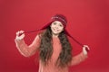 Small child ready for winter. kid fashion. Warm knitting tips. happy girl in earflap hat. holiday activity outdoor