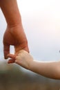 A small child`s hand in his father`s big palm. Royalty Free Stock Photo