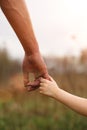 A small child`s hand in his father`s big palm. Royalty Free Stock Photo