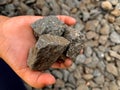 A small childÃ¢â¬â¢s hand holding several pebbles Royalty Free Stock Photo