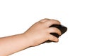Small child`s hand holds a black computer mouse. Royalty Free Stock Photo