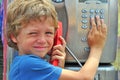 Small child talking by phone Royalty Free Stock Photo