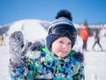 A small child walks in the winter Park. Playing and smiling baby on white fluffy snow. Active rest and games. Royalty Free Stock Photo