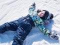 A small child walks in the winter Park. Playing and smiling baby on white fluffy snow. Active rest and games. Royalty Free Stock Photo