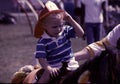 Small child wearing a fireman`s helmet