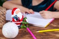 Small child writes the letter to Santa