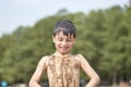 Small children bathe in water smear dirt on their body and rejoice Royalty Free Stock Photo