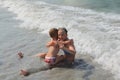 Small children brother and sister having fun on the beach