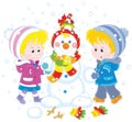 Small children making a funny Christmas snowman