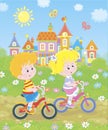 Small children riding bicycles