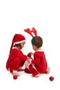 Small children in santa costume playing