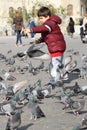 Small children who feed the birds.