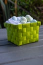 Chocolate eggs in a green presentation basket