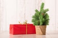 Small chrismast tree and gift on wooden background Royalty Free Stock Photo