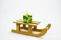 Christmas gift box on wooden sledges.