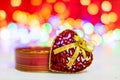 Small Christmas stockings and heart shaped Christmas ornament. Christmas composition on blurred lights background Royalty Free Stock Photo