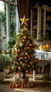 A small christmas tree decorated with oranges and gold stars Royalty Free Stock Photo