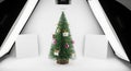 Small Christmas tree with ornaments in a studio setup with softboxes Royalty Free Stock Photo