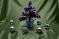 A small Christmas tree in a pot, decorated with balls, garlands and lights. Royalty Free Stock Photo