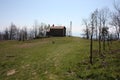 Small church abandoned, in disuse, on the Apuan Alps of the Tuscan Apennines in a clearing on a sunny spring day Royalty Free Stock Photo