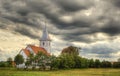 Small church against dramatic sky