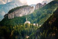 Small church with a chapel on a background of a mountain forest in the Italian Dolomite Alps, Italy