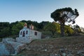 Small church on a hill over Skopelos town at sunrise, island of Skopelos