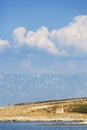 A small church on island Rab with mountains in background Royalty Free Stock Photo