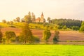 Small church in the middle of lush green spring landscape on sunny day. St. Peter and Pauls church at Bysicky near Lazne Royalty Free Stock Photo