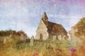 A small church surrounded by a graveyard in the English countryside on a summers day. With a dreamy, magical edit